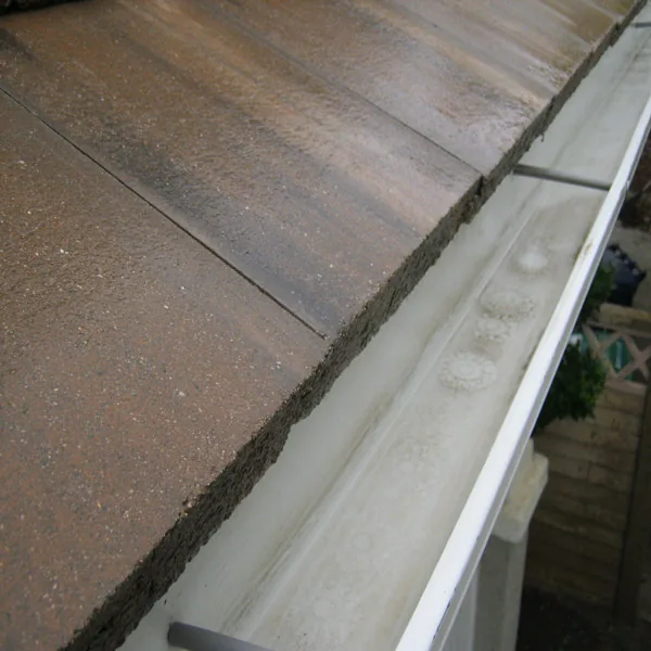 Same residential rain gutter after cleaning