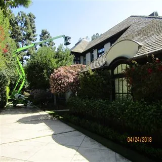 Exterior cleaning project photo showing roof lift access.
