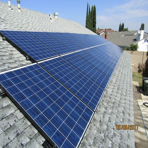 Roof-mounted solar panels on a shingle roof.