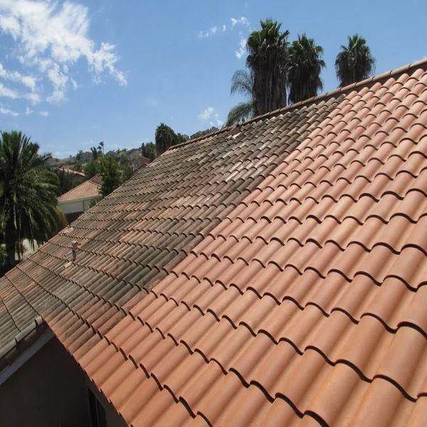 Roof cleaning service on smooth terra cotta tile roof