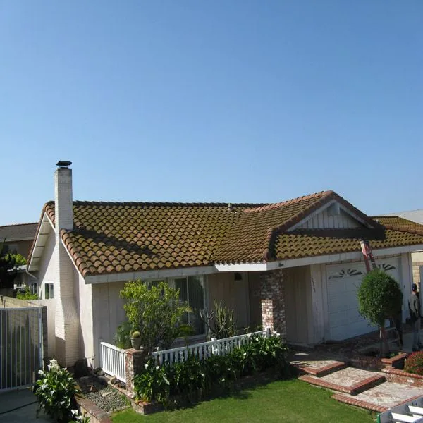 Roof cleaning project on a Huntington Beach tile roof before service