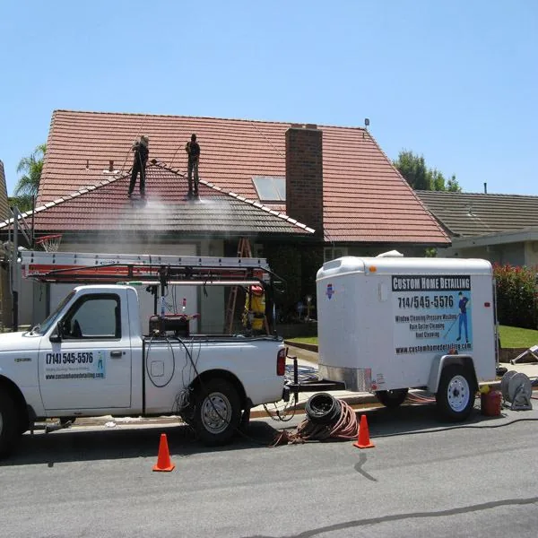 After roof cleaning photo as technicians finish a tile roof project