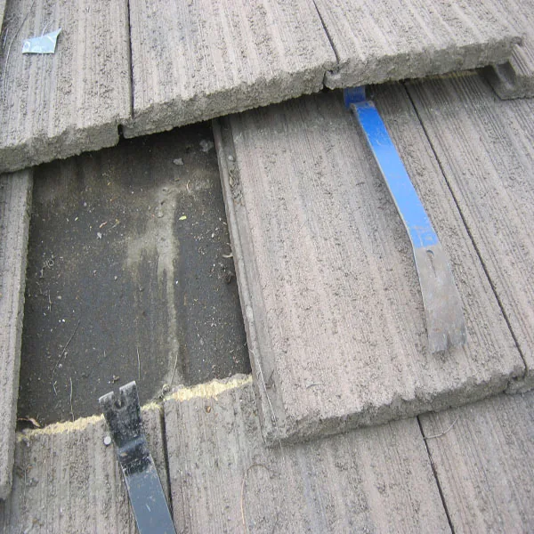 Slate roof before repair used as a companion view for coastal and hillside condition review.