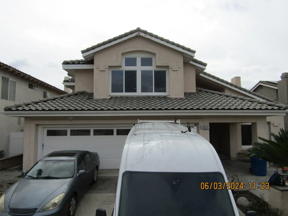 Same tile-roof home after the documented cleaning project
