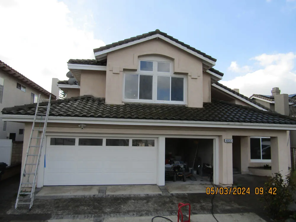 Tile-roof home before a documented cleaning project